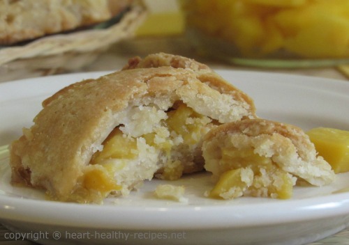 Close-up of mango cobbler dessert on serving dish.