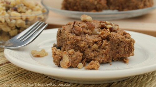 Cinnamon bar with walnuts and more cinnamon bars in background.