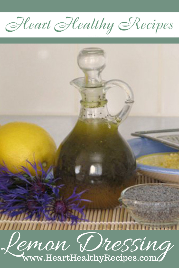 Honey Poppy Seed Dressing in glass container with lemons, poppyseeds and purple flowers - Pinterest Pin