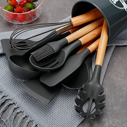 Wooden Handle Black Silicone Cooking Utensil Set laying on Kitchen Counter.