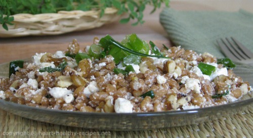 Walnut spelt dish with feta cheese on serving plate.
