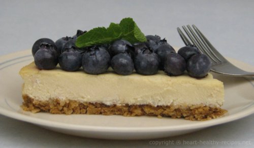 Blueberry Lemon Cheesecake wedge with mint garnish.