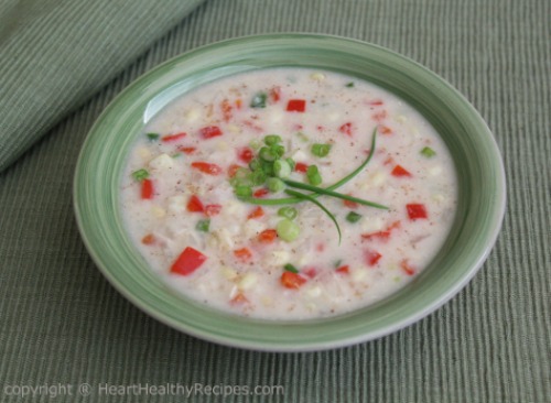 Creamy corn chowder with fancy green onion garnish.