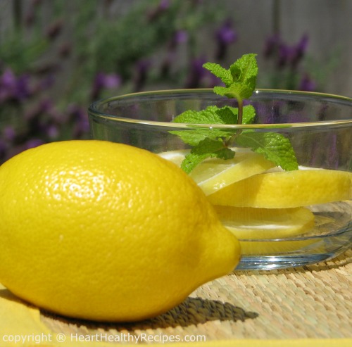 Close-up of fresh lemon on sunny day with more in the background.