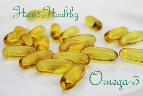 Close-up grouping of individual heart healthy oils consisting of Omega-3 supplement capsules.