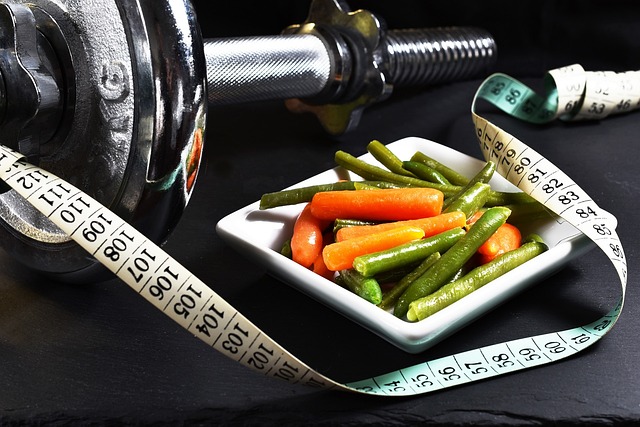 Weights with vegetables and measuring tape.