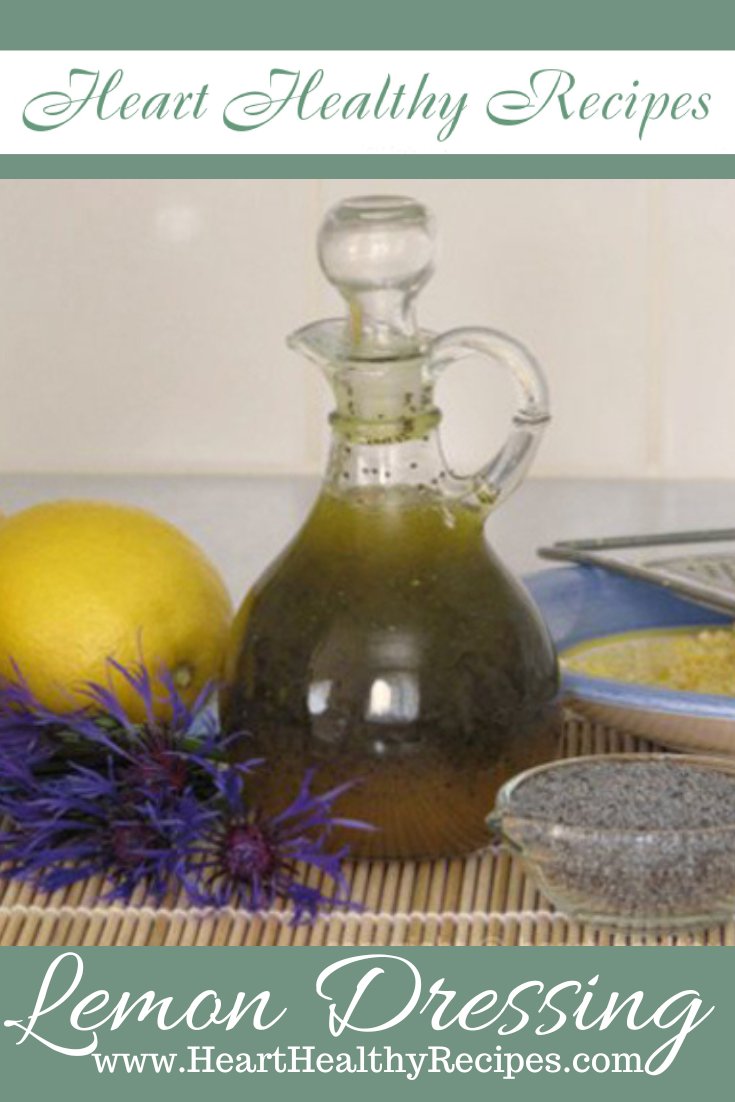 Honey Poppy Seed Dressing in glass container with lemons, poppyseeds and purple flowers - Pinterest Pin