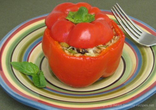 Close-up of Stuffed Mediterranean bell pepper with basil garnish.