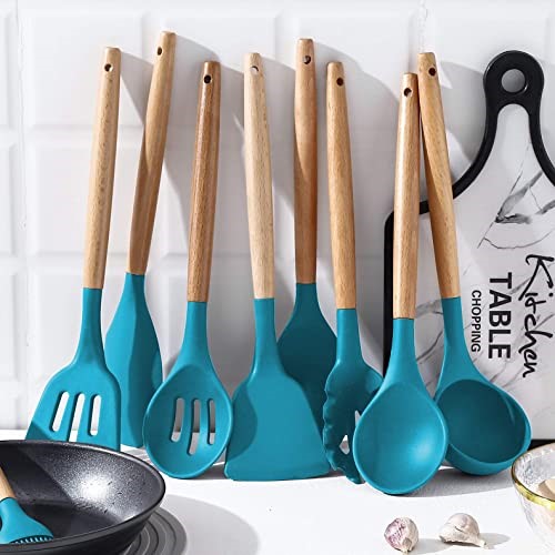 Set of nine kitchen utensils displayed in kitchen with white tiled background.